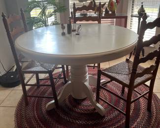 Nice kitchen table, rug, and four chairs. All being sold separately.