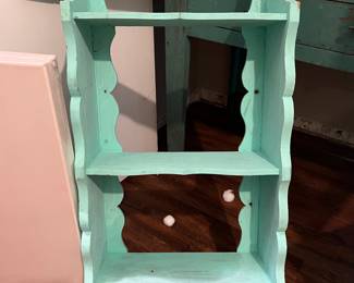 Mint color wooden wall shelf. This could be painted any color.