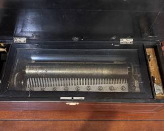 Antique brass roll music box