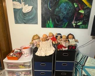 Cabbage patch dolls, rolling storage carts, art work