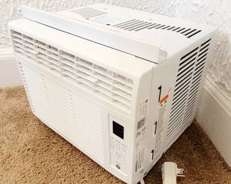 White 6,000 BTU 250 SQF GE Window A/C Unit w Remote and installation kit (model AWCS06BWT1). Used less than two months. LIKE NEW