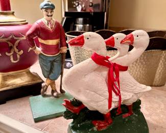 The geese and the golfer are iron doorstops!