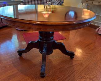 We also have one leaf for this pretty round pedestal table, turning it into an oval table. No chairs…sorry!