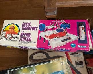 Several six million dollar man 1970's collectibles in original boxes