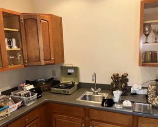 Bar items, cds, dvds, and large collection of corks.