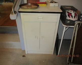 Metal cabinet with enamel top