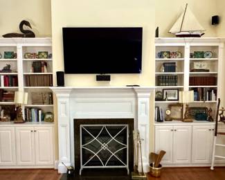 Modern fireplace screen, books, model ship, stained glass pieces