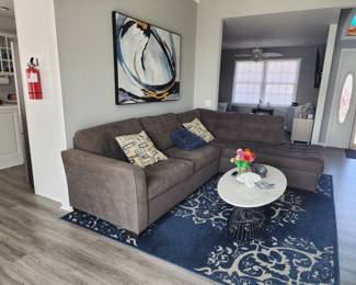 SECTIONAL AND CARPET SOLD