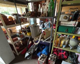 Old bottles, camping equipment, camp fuel, paper shredder, vacuums, AC unit