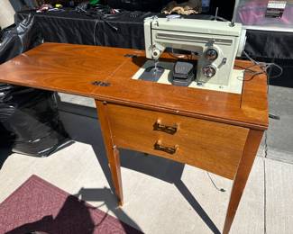 Sewing machine and table