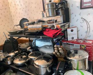 Packed kitchen with large assortment of cookware