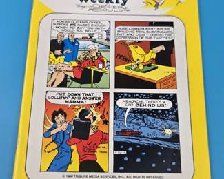 Dick Tracy Weekly comic book, issue #64, featuring the classic comic strip character Dick Tracy.
Product: Dick Tracy Weekly comic book, issue #64.
Content: The cover features four panels from the comic strip, with the titles "HEADACHE," "POPSIE," and "MAMMA" at the bottom.