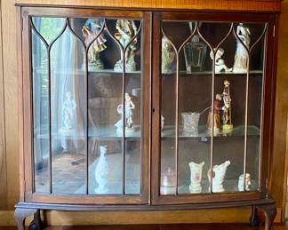 antique curio cabinet and the porcelain inside
