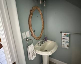 pedestal sink, light fixture, wood mirror