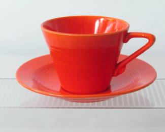 Close up of red Harlequin cup and saucer