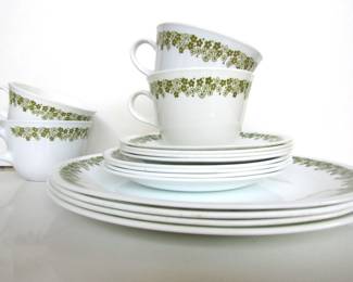 1970s "Crazy Daisy" Corelle dishes. 16 pieces includes four dinner plates, four salad plates, four mugs, and four saucers. Official pattern name is Spring Blossom.