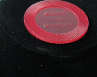 Close up of a "Silent Partner" poker chip.