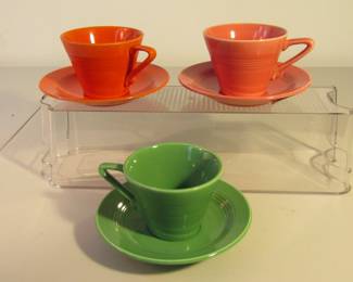 Three Harlequin cups and saucers