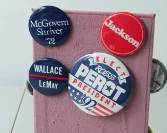 Four pins from candidates who wanted to be president.