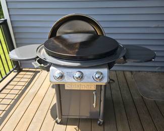 Like new 30" Cuisnart flattop grill. Comes with two propane tanks, one almost full.