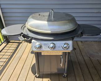 Like new 30" Cuisnart flattop grill. Comes with two propane tanks, one almost full.