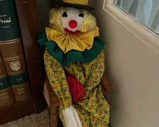 Clown Doll In Wooden Chair
