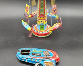 Vintage Shudo Japan Tin Litho Toy Space Gun, & Reproduction Schylling Tin Litho Toy Rocket Ride Tin Carousel Toy made in 2000