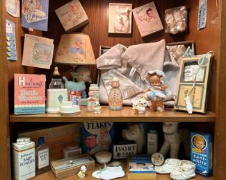 1950's Baby Display Items: Dr. Spock Book, Ceramic Lamb Lamp, Ceramic Lamb & Pig Decor, Layette Set, Booties, Glass Bottle & Bottle Warmers, Baby Shower Game & Cards, and more Vintage Baby Supplies, as pictured