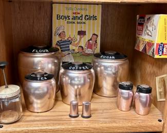 Mid Century Kromex Aluminum Canisters & Shakers,
Chopper, and other accessories as pictured in display