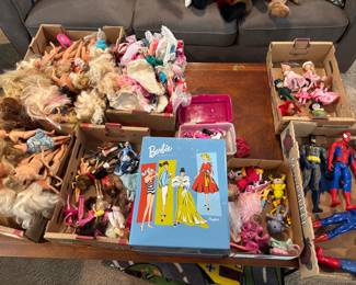 Barbies, these Barbies are undressed, but there is a box full of clothes these are mostly vintage Barbies from the 80s 90s and up