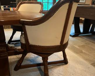 Card table with leather swivel chairs