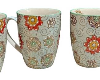 Four Small Tea Cups With Floral Design