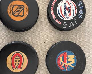 A collection of NHL Hockey Pucks