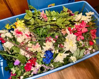Two totes full of silk flowers