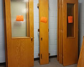 Several maple loose hanging doors various sizes shown