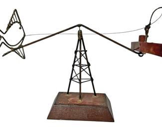 Whimsical Teetering Fisherman Sculpture