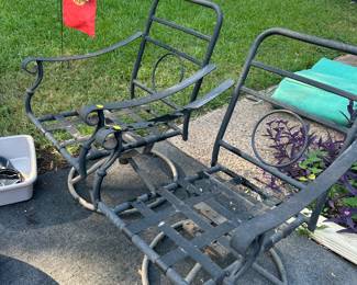 Two metal patio chairs