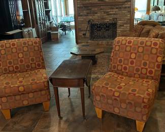 Two slipper chairs with geometric pattern.