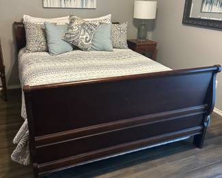 Queen size sleigh bed.