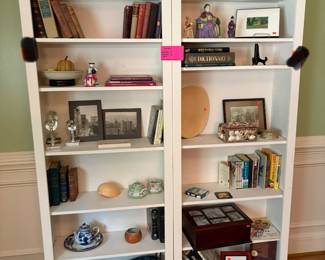 White bookcases are sold.  Using for display until customer picks up.  