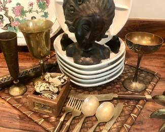 Balinese sculpture with sushi plates and flatware from Thailand