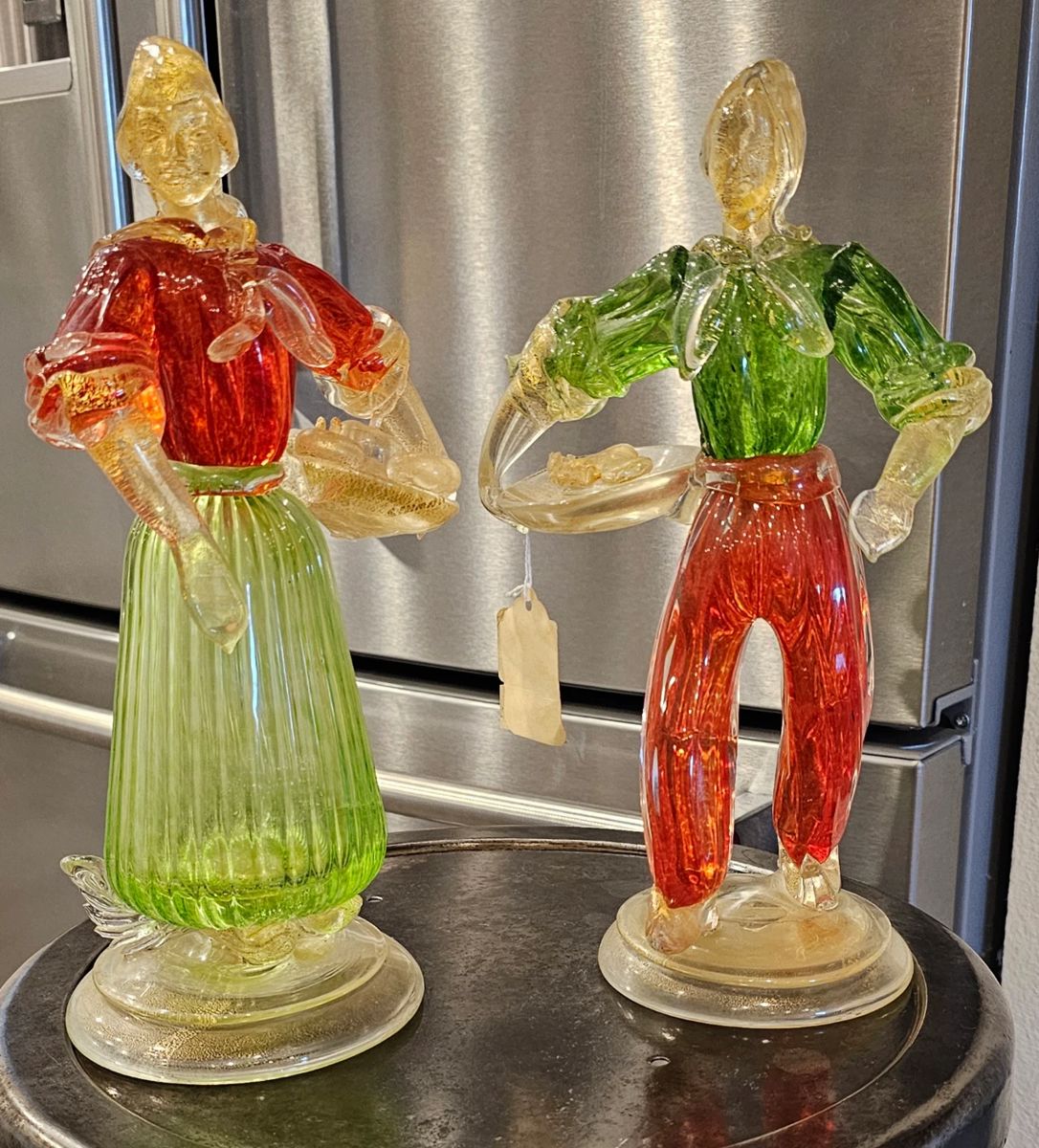 Murano-style Venetian Glass Peasant Figures (Pair).
Hand-blown Italian glass, mid-century. Minor internal glass stress line on female figure.