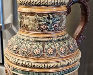Oversized German Lidded Presentation Stein. 16" tall
D.R.G.M. Registered Design
High-relief figural decoration
Pewter lid