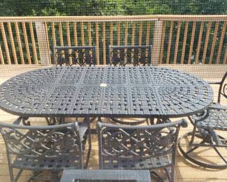 Patio table w 6 swival rocker chairs