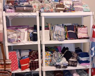 Lots of fabric for quilting, jelly rolls, fat quarters