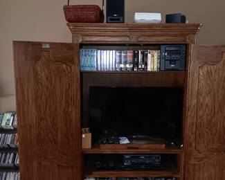 Entertainment center, flat screen tv, lots of movies
