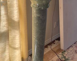 solid stone stand - comes in 3 pieces ridiculously heavy each piece is heavy !!