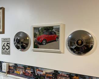 Garage items, VW Wolfsburg Castle Bug Hub caps (two are available) and one vintage Porsche hub cap