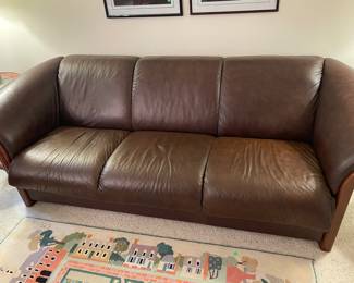 Leather couch with wood accents