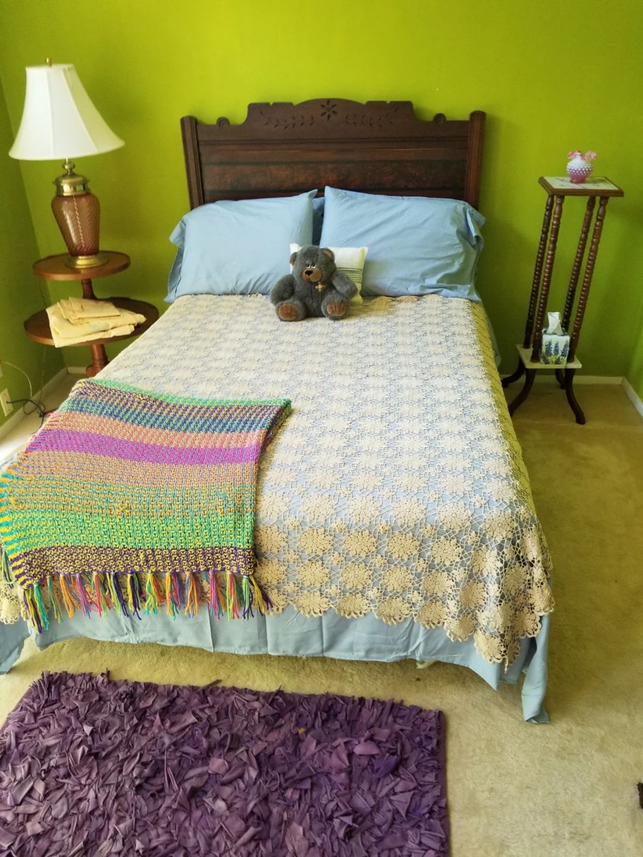 Antique double bed including linens